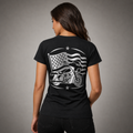 Street Beauty reflective women's motorcycle V-neck tee - back view showing rider on touring bagger with waving American flag reflective vinyl design