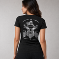 Three Wheel Adventure reflective women's V-neck tee - back view showing woman rider on wide-stance three-wheeler in crescent star frame reflective vinyl design