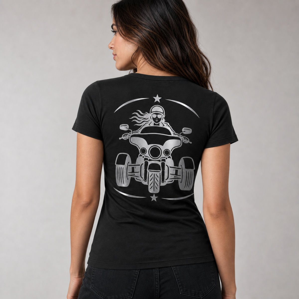 Three Wheel Adventure reflective women's V-neck tee - back view showing woman rider on wide-stance three-wheeler in crescent star frame reflective vinyl design