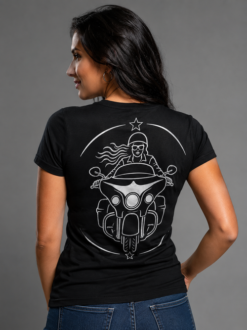 American Spirit reflective women's motorcycle V-neck tee - back view showing smiling woman rider on touring bagger in crescent star frame reflective vinyl design